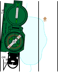 Step 2: laying the compass's straight edge along the Magnetic North reference line